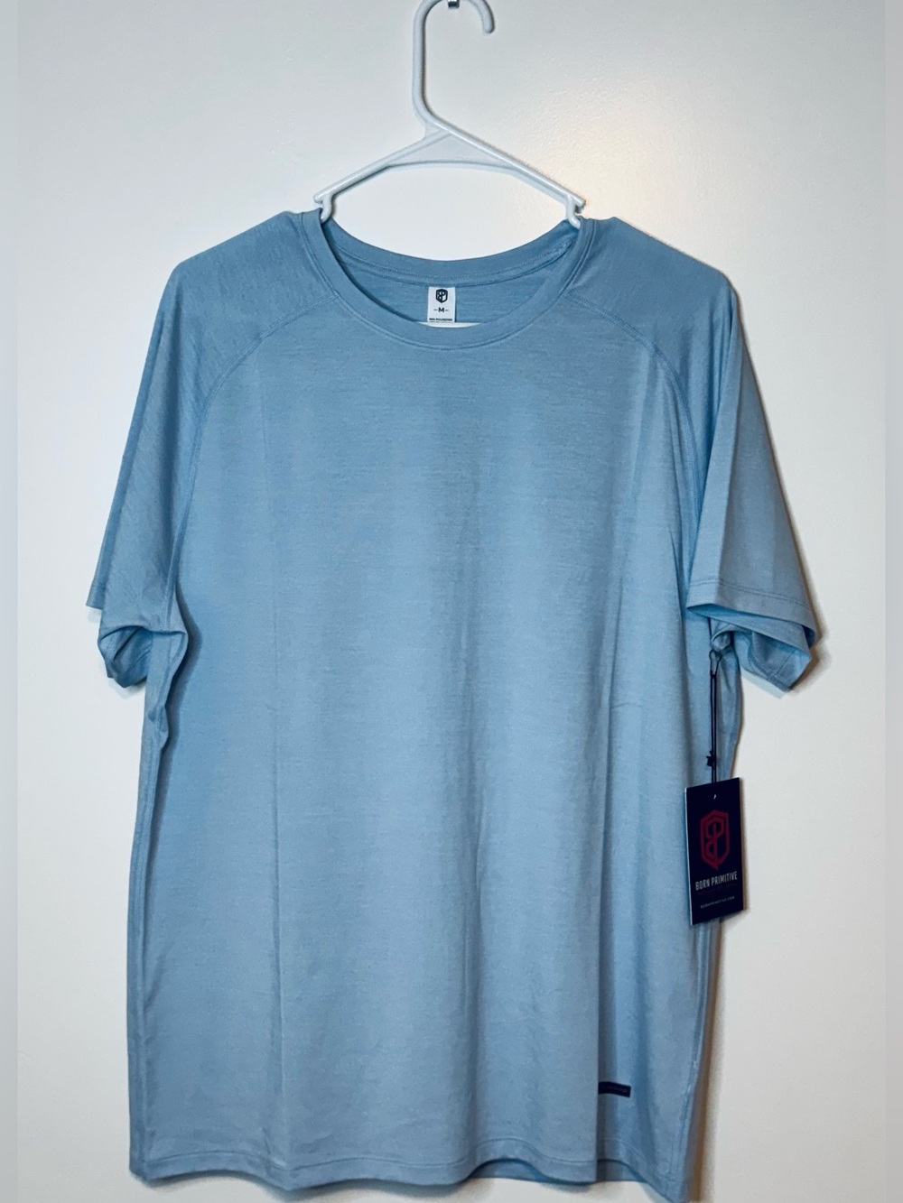 NWT Born Primitive men’s training tee in blue (chambray), size medium.